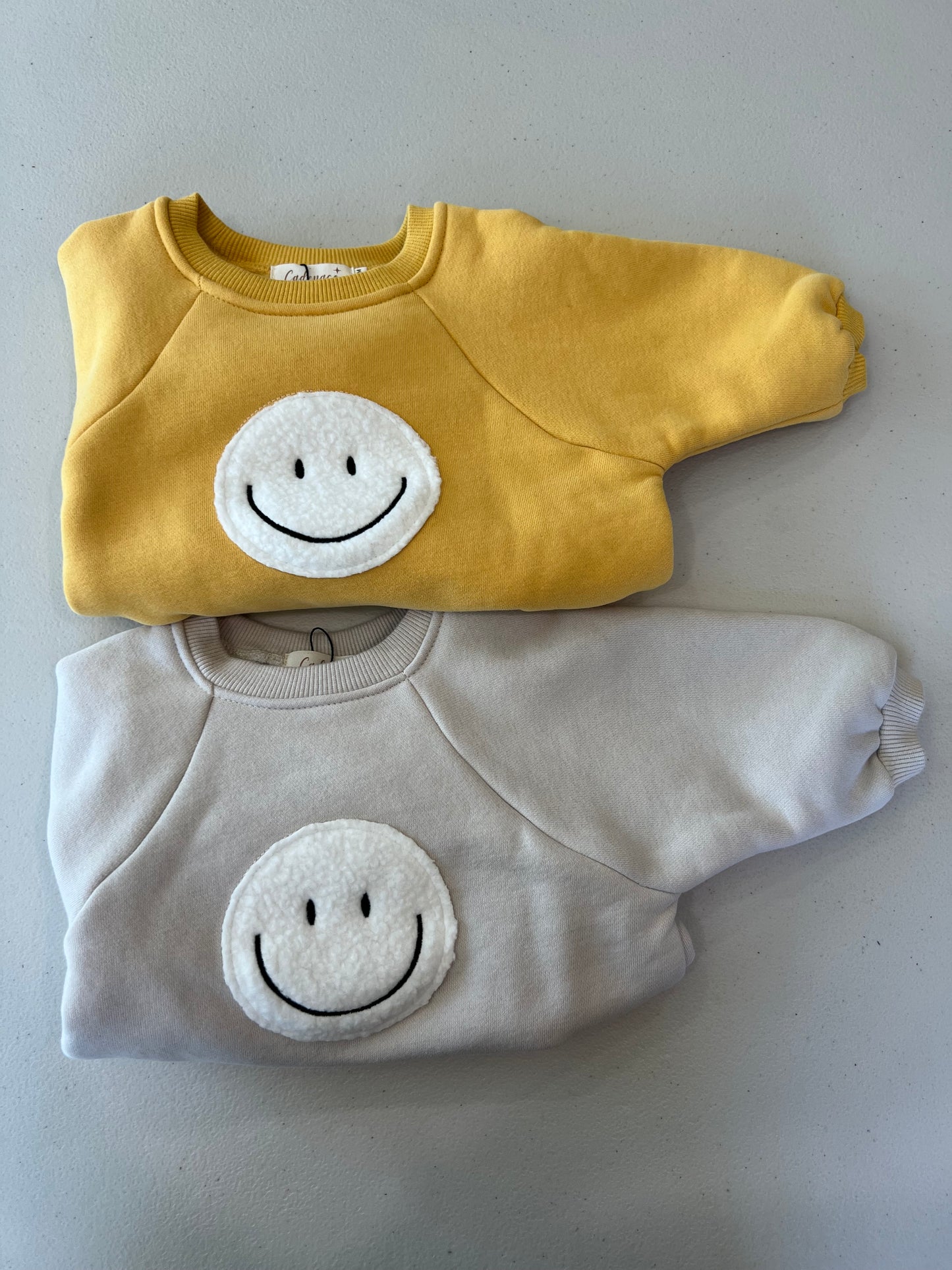 SMILEY FACE ROMPER