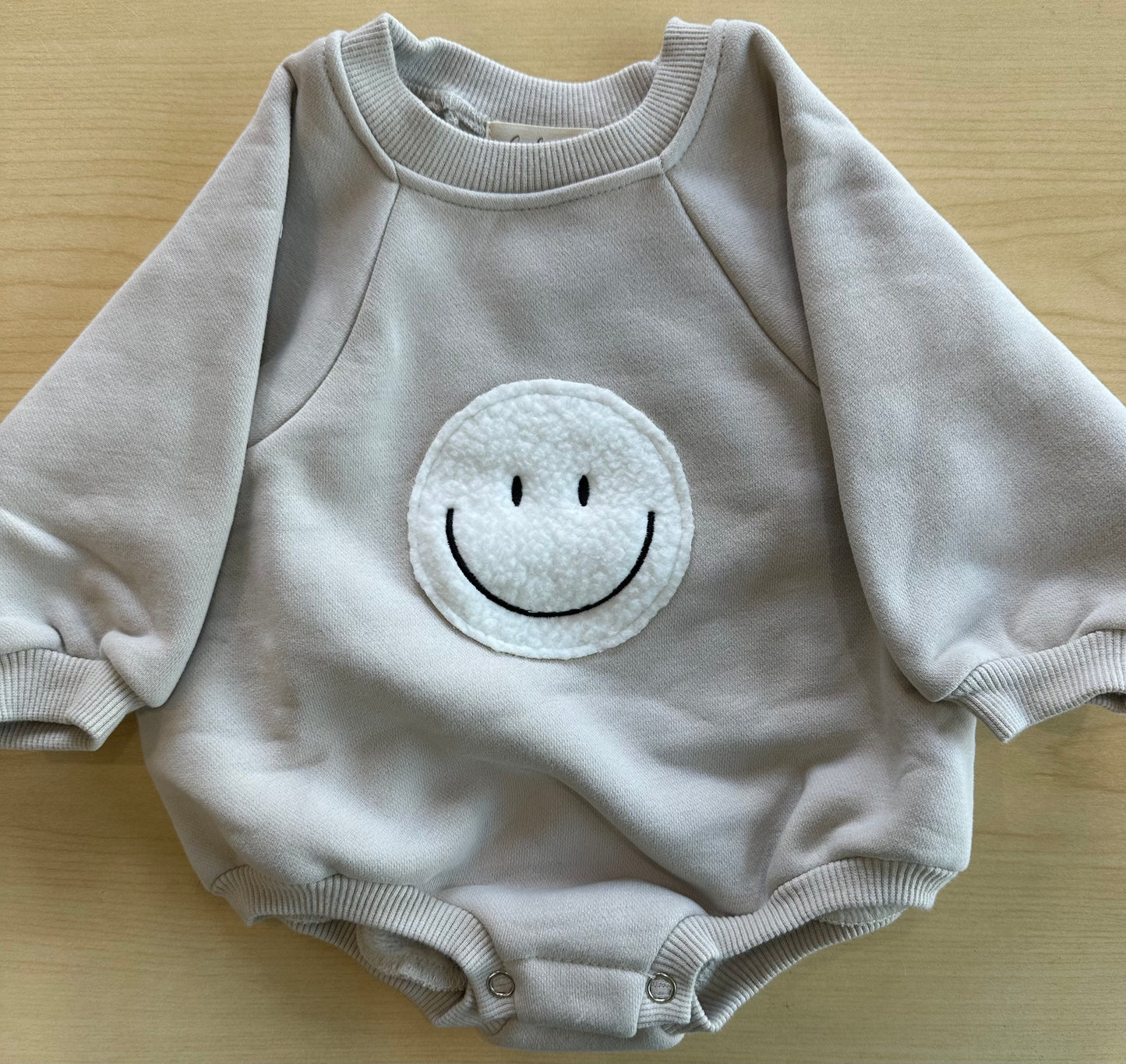 SMILEY FACE ROMPER